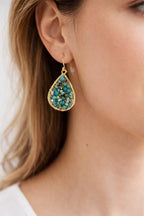 tiny turquoise earring on model