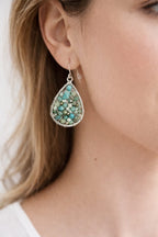 tiny turquoise earring silver on model