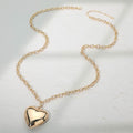 Two Tone gold dippd heart necklace featuring two interlinked heart pendants in a contrasting finish. A symbol of love and unity, perfect for adding elegance to daily wear or gifting on special occasions.