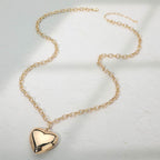 Two Tone gold dippd heart necklace featuring two interlinked heart pendants in a contrasting finish. A symbol of love and unity, perfect for adding elegance to daily wear or gifting on special occasions.
